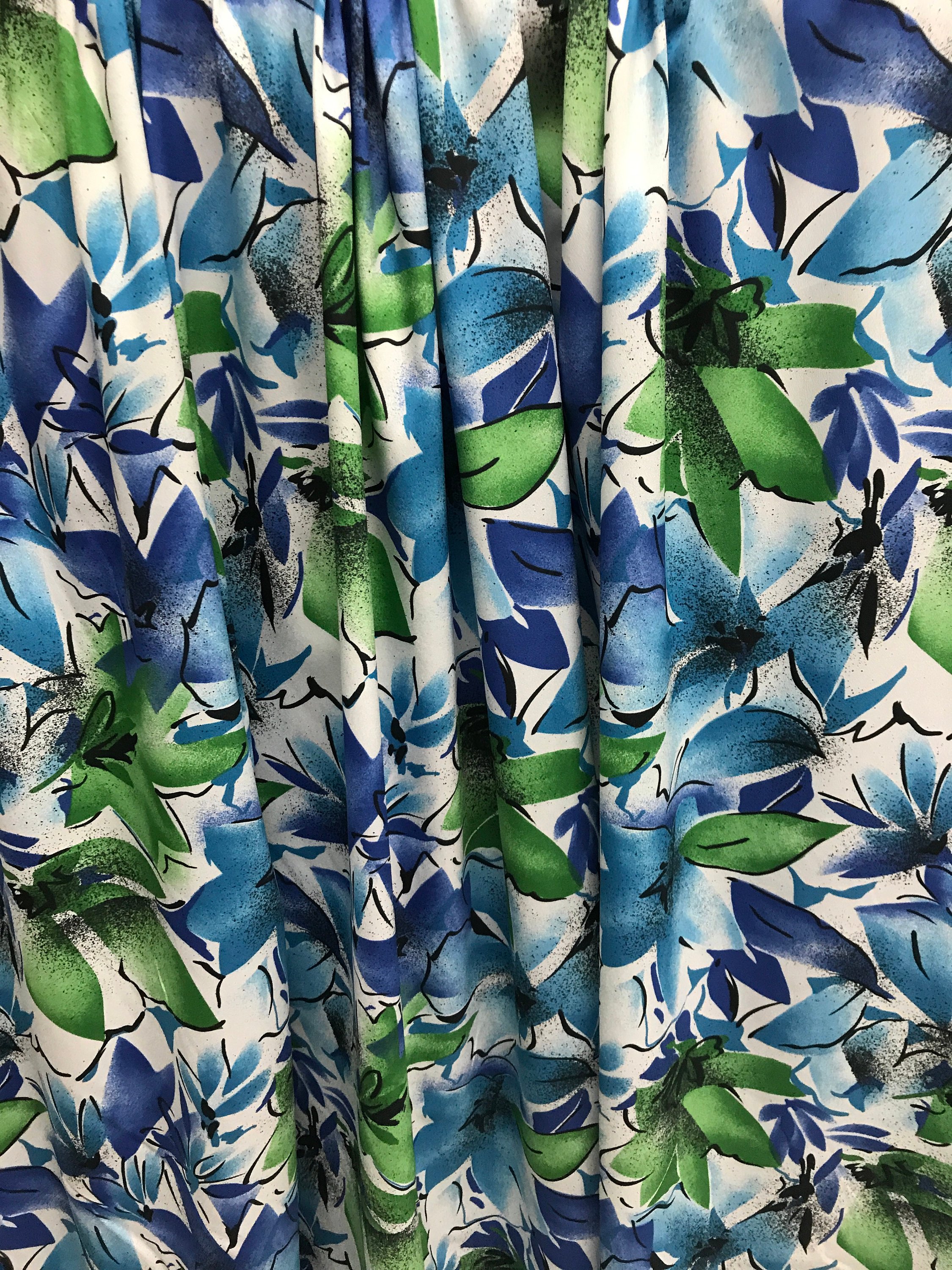 polyester crepe de chin print fabric floral blue green flowers white background 140cm wide